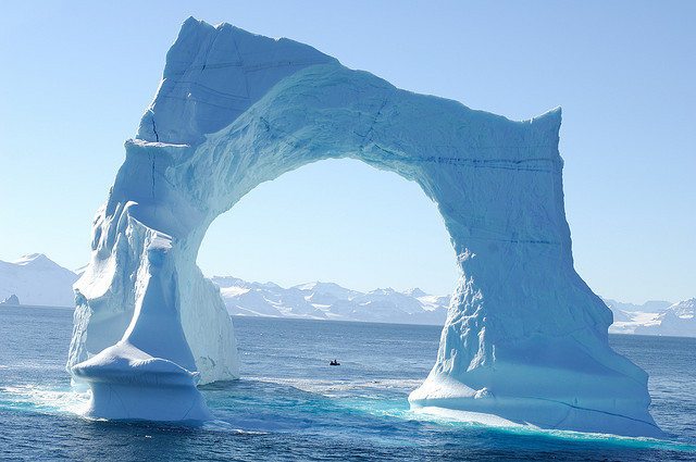 by francois Dequidt on Flickr.Floating arch iceberg in the waters of Greenland.