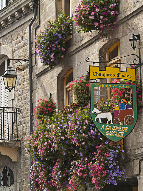 Street signs in Moncontour, a beautiful village in Brittany, France