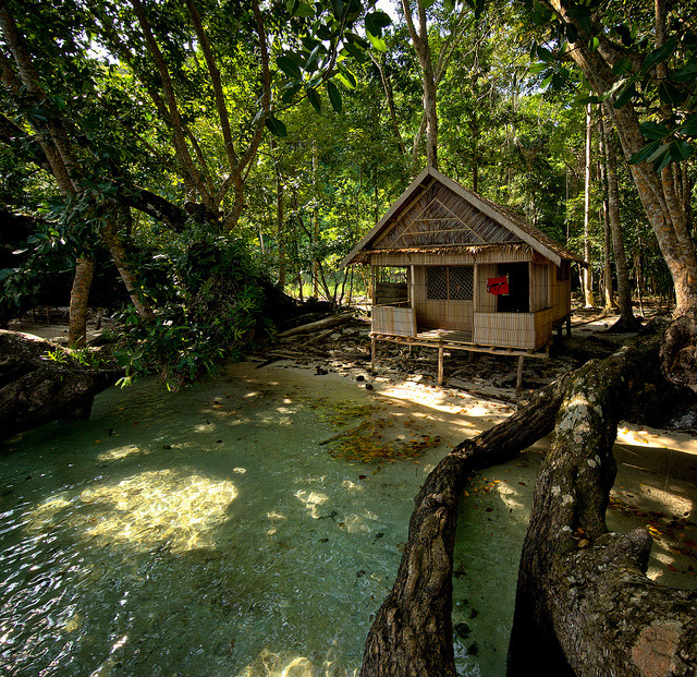 Wooden cabin at the end of Milne Bay, Papua New Guinea
