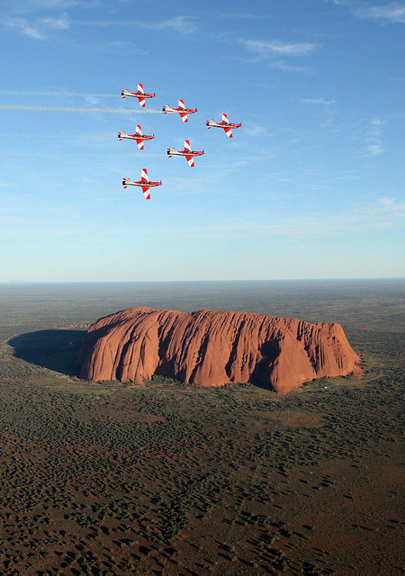The Roulettes fly in wedge formation over Ayers Rock, Australia
